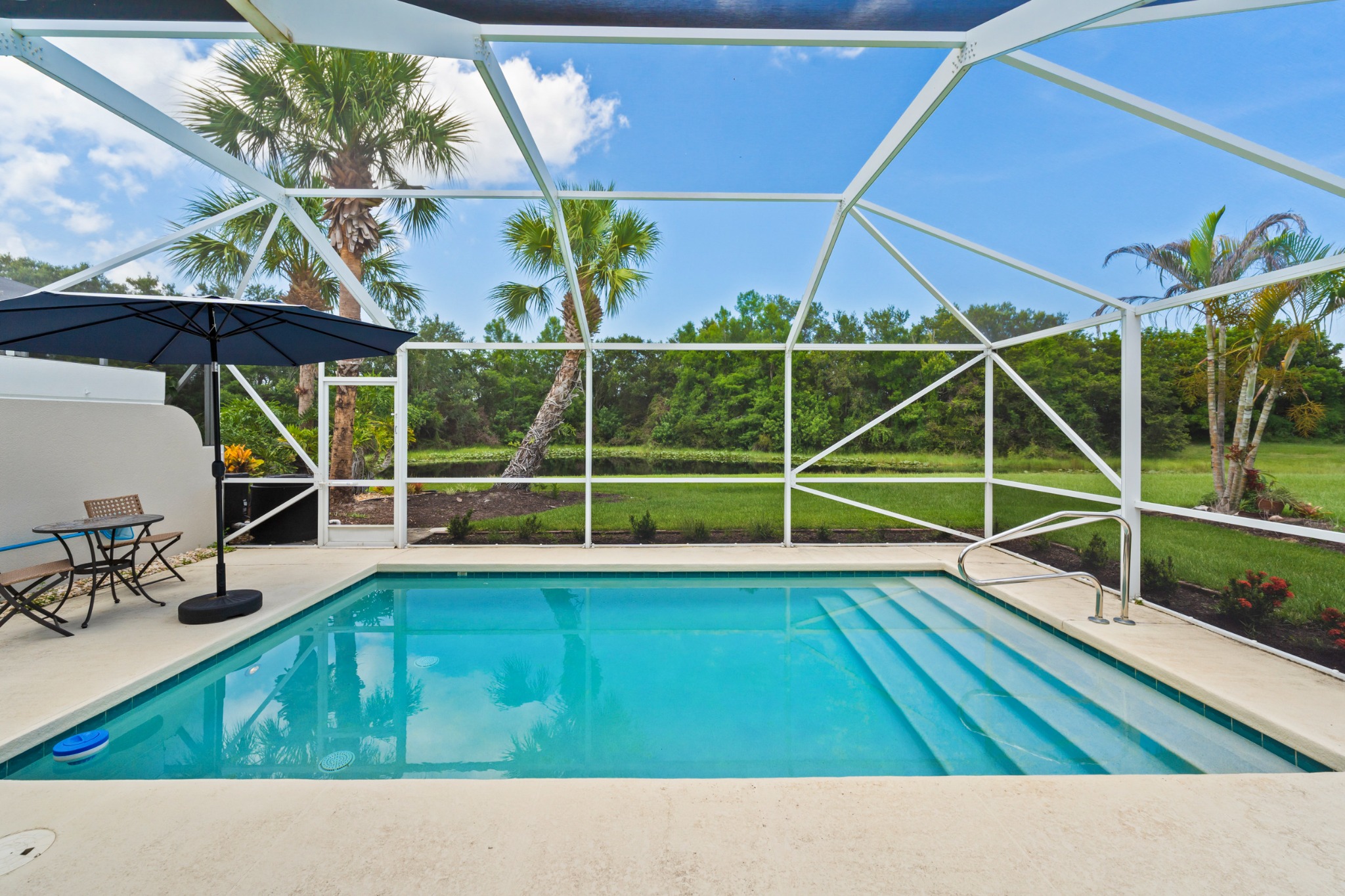 Screened private pool overlooking a peaceful preserve at 8437 SE Retreat Drive